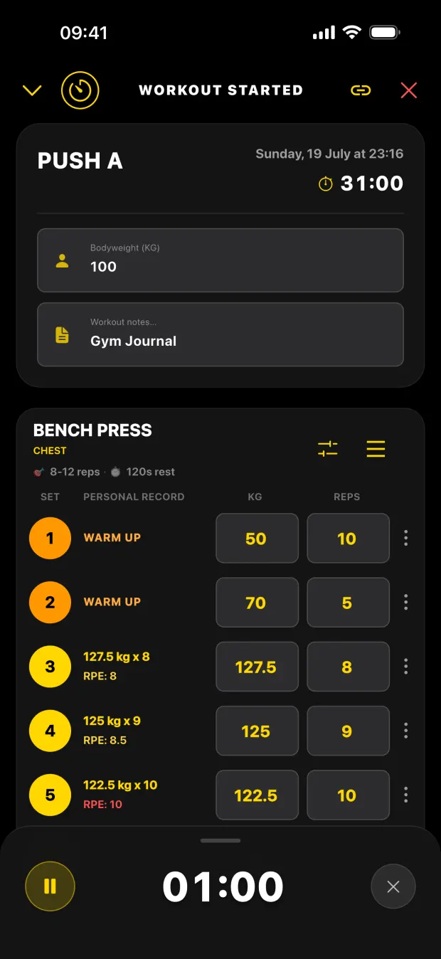 Logging a bench press set in Gym Journal, with previous personal records beside each set and the rest timer counting down